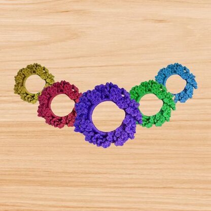 A crochet flower scrunchie