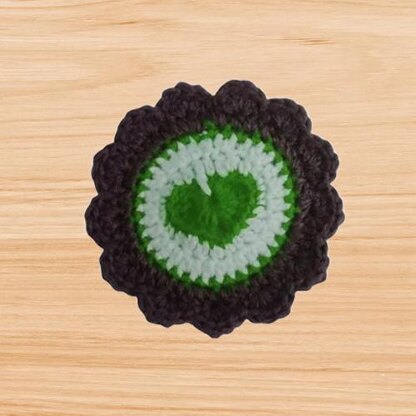 Crochet round coaster with heart