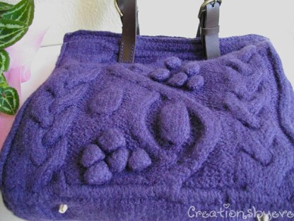 Purple bag with bobbles and cables