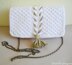 White knit clutch with gold tassel