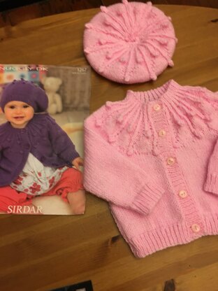 Pink bobble hat and cardigan