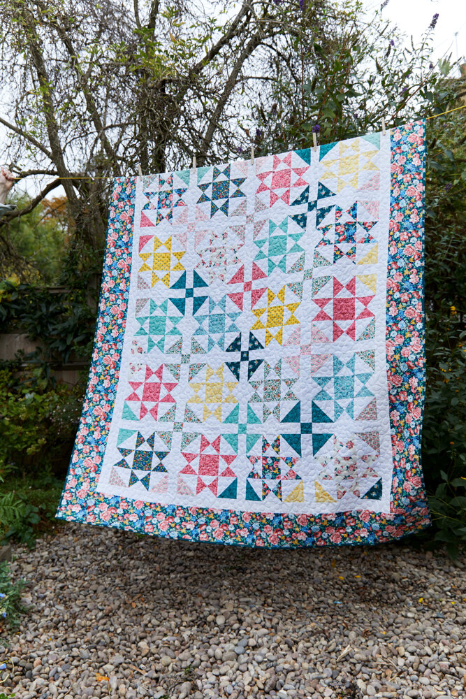 "Liberty Merchant Bright's Quilt from the Emporium Collection” is a Free Spring Quilt Pattern designed by Liberty Fabric from Love Crafts!