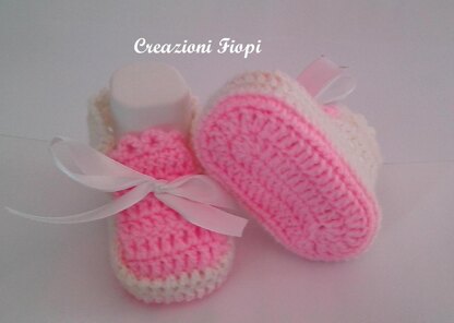 Pink and white baby shoes