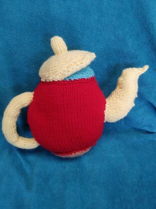 Knitted Teapot and a cup in a saucer ( Mrs. Potts and Chip)