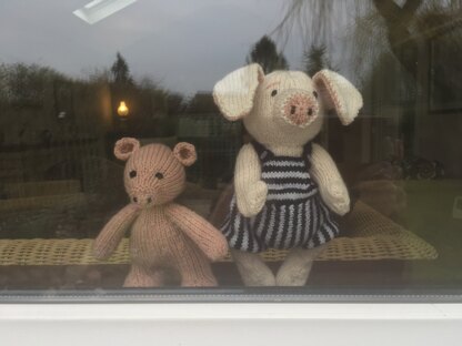 A pair of piglets watch the rain.