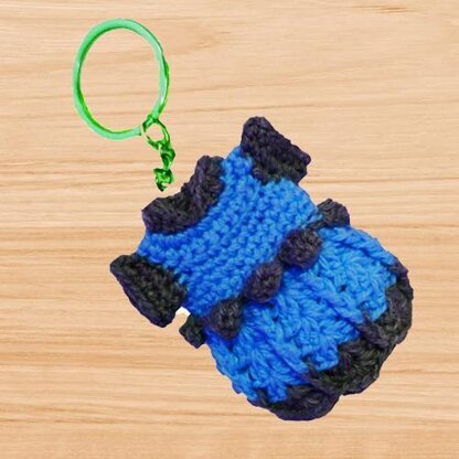 A crochet min dress keychain