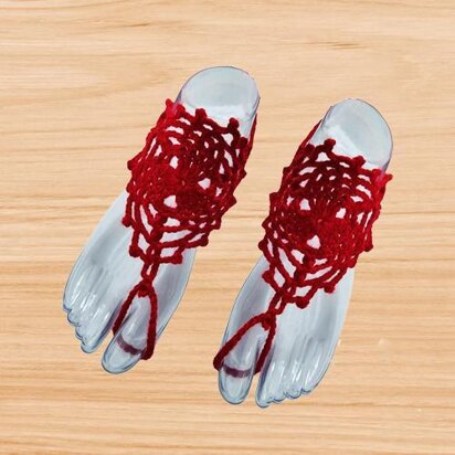 A crochet red barefoot sandal
