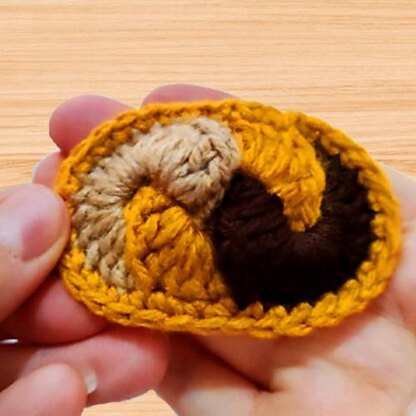 A crochet oval hair clip