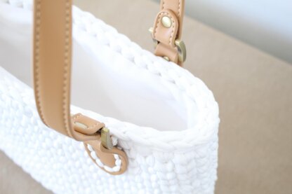 Handbag with leather straps