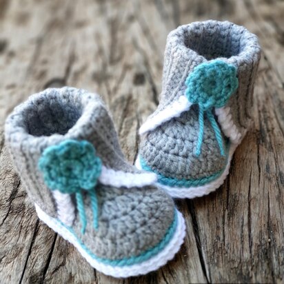 Baby bootie with split cuff and flower detail