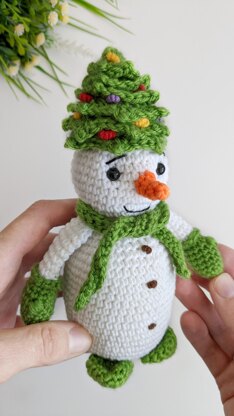 Crochet snowman in a Christmas tree hat amigurumi pattern