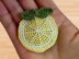 A crochet lemon hair clip