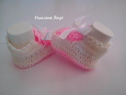 Pink and white baby shoes