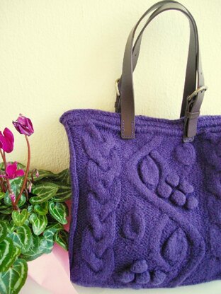 Purple bag with bobbles and cables