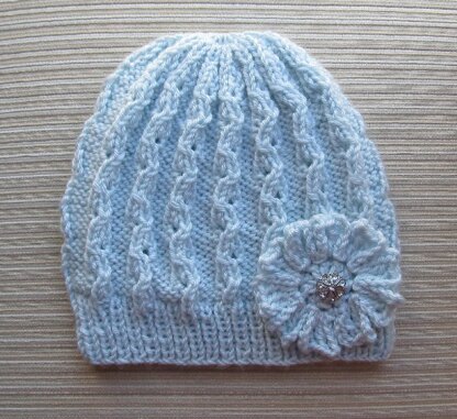 Blue Lacy Hat with a Crochet Flower for a Lady