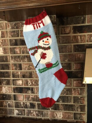 Snowman stocking on skis