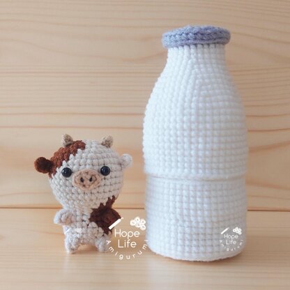 Baby Cow in Giant Milk Bottle