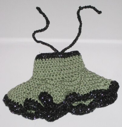 Crochet doll in olive green dress