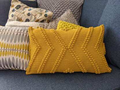 Geometric X bobble cushion cover pattern