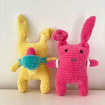 Bunnies with backpack and easter eggs