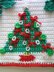 Christmas tree potholder with holly leaf clusters