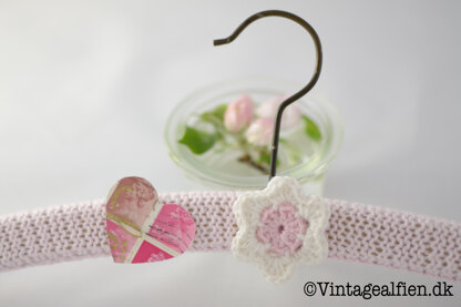 Knitted hanger covers with a decoupage heart