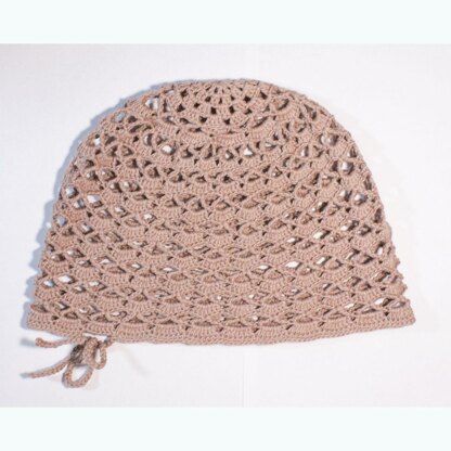 Lacy hat with adjustable strap