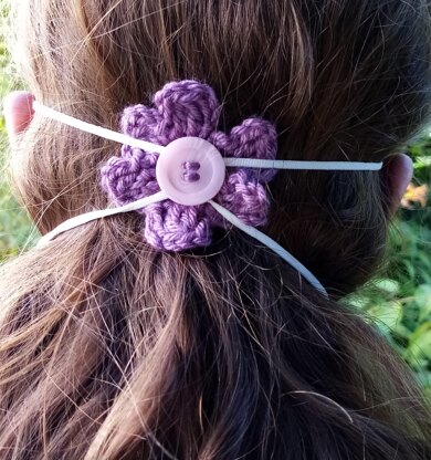 Crochet flower to hold facemask in place