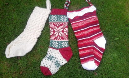 Three traditional knitted Christmas stockings