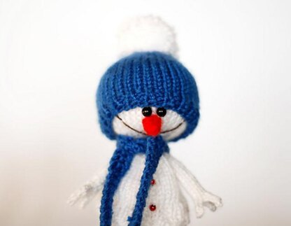 Lovely and sweet Snowman in the blue hat and scarf for keeping warm breakfast egg