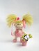 Small funny gardener Doll in the pink dress