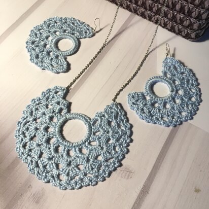 74. Moon-shaped earrings and pendant