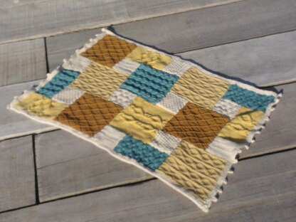 Knitted patchwork cushion, footstool, draught excluder, rug, living room collection