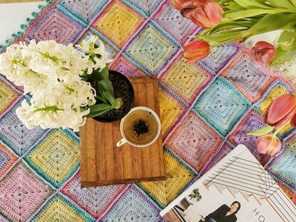 Energy Boosting Granny Square blanket in gradient ombre yarn