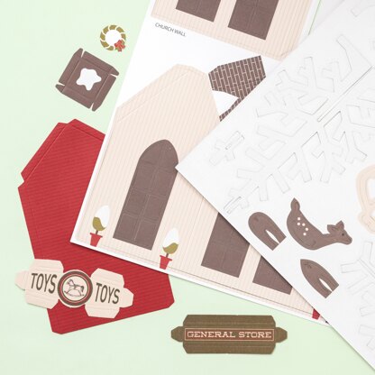 American Crafts DCWV Paper Projects - Christmas Village - Makes 16 Buildings