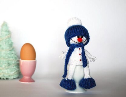 Lovely and sweet Snowman in the blue hat and scarf for keeping warm breakfast egg