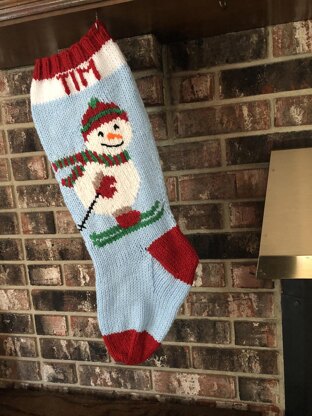 Snowman stocking on skis