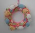 Knitted Easter wreath with chicks and bunnies