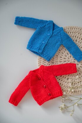 Knitted red cardigan for doll