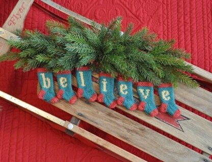 BELIEVE Set of 7 Christmas Stocking Ornaments