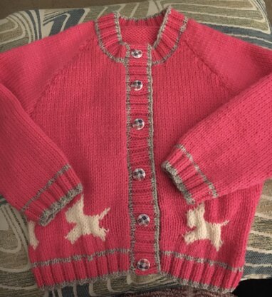 Pink cardigan with dog motif