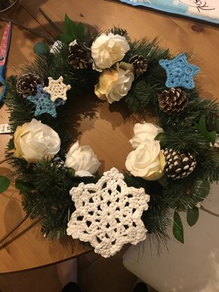 Snowflakes stars and roses wreath