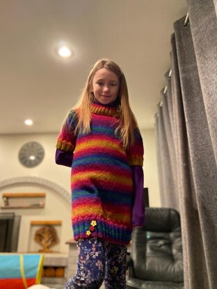 Stripey sweater dress with a hat and scarf to match.