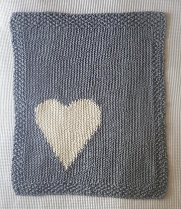 Chunky intarsia heart motif crib/pram blanket