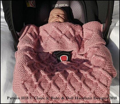 Cabled check blanket to fit car seat, pram or pushchair