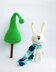 White rabbit in a blue striped scarf