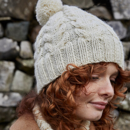 Cabled Bobble Hat - Free Knitting Pattern for Women in Debbie Bliss British Wool Aran by Debbie Bliss