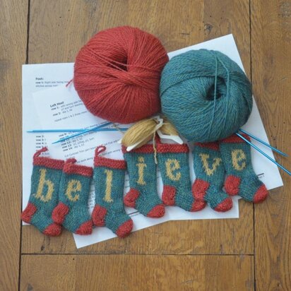 BELIEVE Set of 7 Christmas Stocking Ornaments