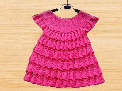 A crochet Pink baby dress