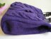 Purple bag with bobbles and cables